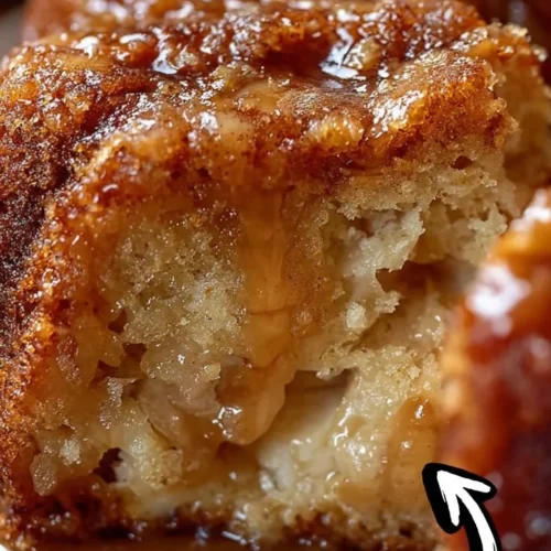 Delicious homemade Apple Bundt Cake garnished with fresh apples and icing