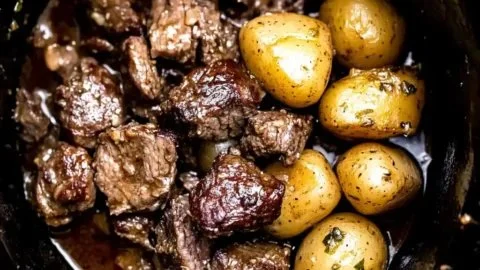 Delicious Crockpot Garlic Butter Beef Bites with Potatoes ready to serve.