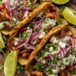 Mediterranean Chicken Tacos with grilled chicken, feta, onions, tzatziki, lime wedges on dark surface vertical collage